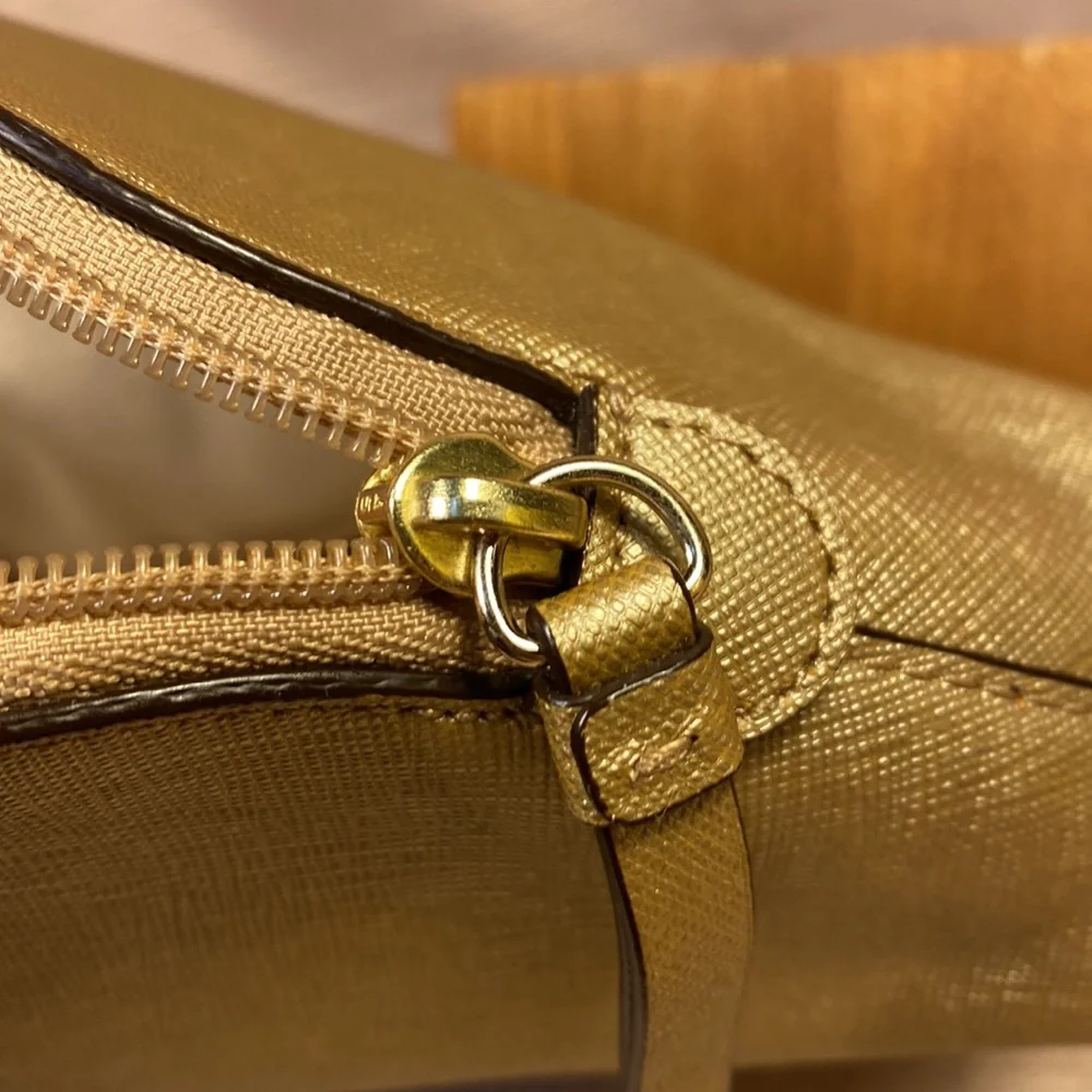 Coach gold metallic color cosmetic pouch w/elegant bow